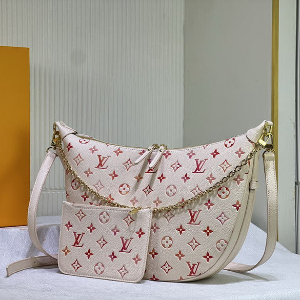 Designer handbag with monogram pattern on a white surface with a Louis Vuitton box in the background.