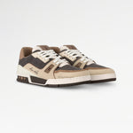 Pair of brown and beige sneakers on a white background