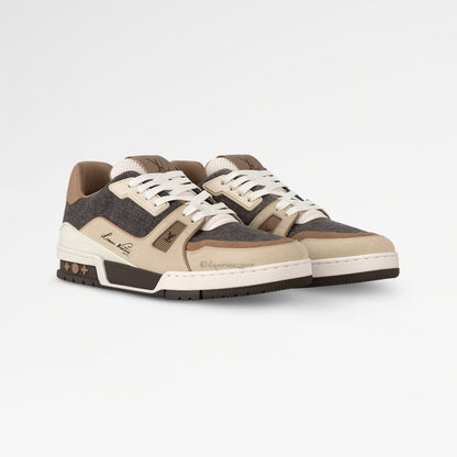 Pair of brown and beige sneakers on a white background