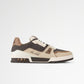 Brown and beige sneaker with white sole on a light gray background